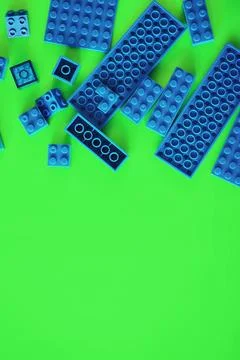 A scattering of constructor elements for children. Colored blue bricks from.. Foto stock