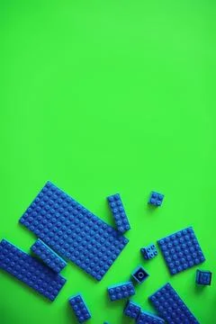 A scattering of constructor elements for children. Colored blue bricks from.. Foto stock
