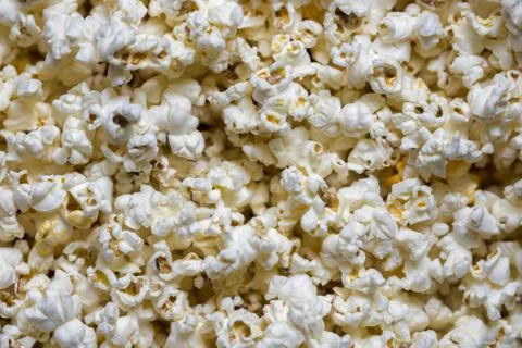 A scattering of cooked popcorn. View from the top. Background. Stock Photos