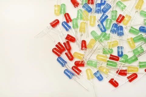 A scattering of LEDs. Multi-colored LEDs in bags. Electronic elements. Stock Photos