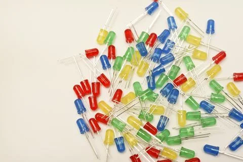 A scattering of LEDs. Multi-colored LEDs in bags. Electronic elements. Stock Photos