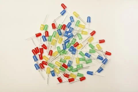 A scattering of LEDs. Multi-colored LEDs in bags. Electronic elements. Stock Photos
