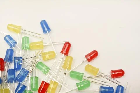 A scattering of LEDs. Multi-colored LEDs in bags. Electronic elements. Stock Photos