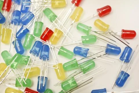 A scattering of LEDs. Multi-colored LEDs in bags. Electronic elements. Stock Photos