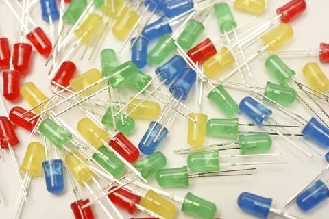 A scattering of LEDs. Multi-colored LEDs in bags. Electronic elements. Stock Photos