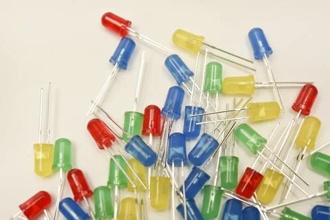 A scattering of LEDs. Multi-colored LEDs in bags. Electronic elements. 스톡 사진