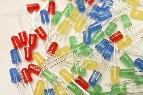 A scattering of LEDs. Multi-colored LEDs in bags. Electronic elements. Stock Photos