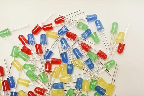 A scattering of LEDs. Multi-colored LEDs in bags. Electronic elements. Stock Photos