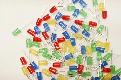 A scattering of LEDs. Multi-colored LEDs in bags. Electronic elements. Stock Photos