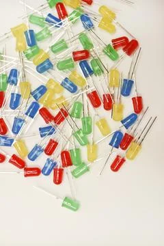 A scattering of LEDs. Multi-colored LEDs in bags. Electronic elements. Stock Photos