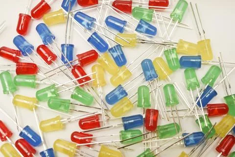 A scattering of LEDs. Multi-colored LEDs in bags. Electronic elements. Stock Photos