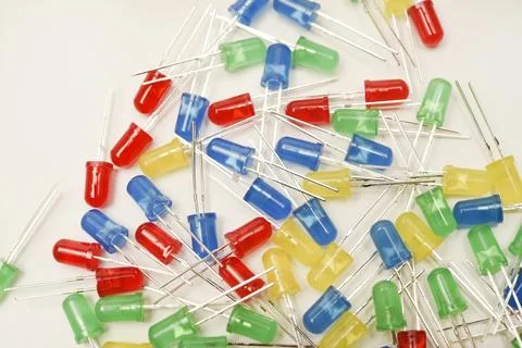 A scattering of LEDs. Multi-colored LEDs in bags. Electronic elements. Stock Photos