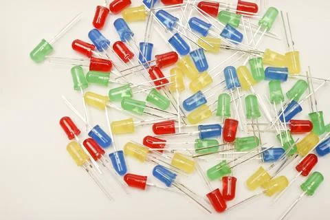 A scattering of LEDs. Multi-colored LEDs in bags. Electronic elements. Stock Photos