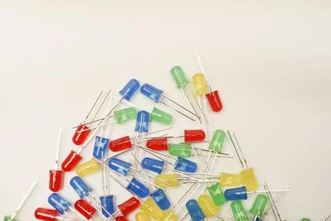 A scattering of LEDs. Multi-colored LEDs in bags. Electronic elements. Stock Photos