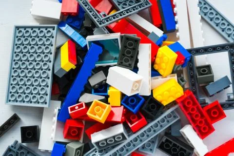 A scattering of many colored blocks from the designer. a house made of colored Stock Photos