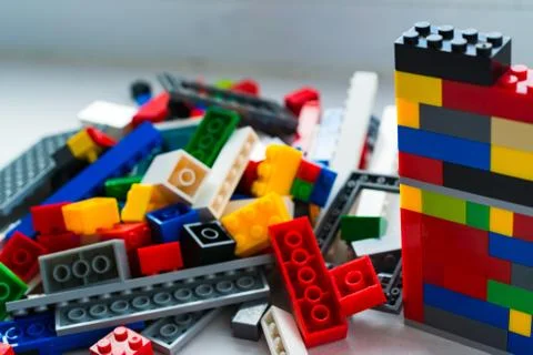 A scattering of many colored blocks from the designer. a house made of colored Stock Photos