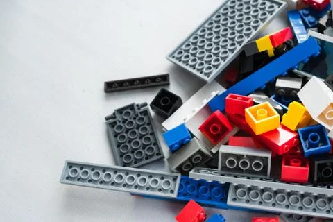 A scattering of many colored blocks from the designer. a house made of colored Stock Photos