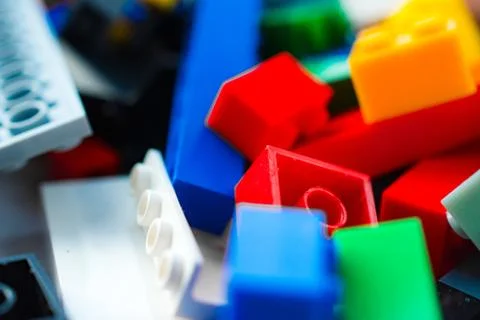 A scattering of many colored blocks from the designer. a house made of colored Stock Photos