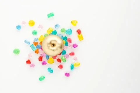 A scattering of many small different gems on a white background. Multicolor Stock Photos