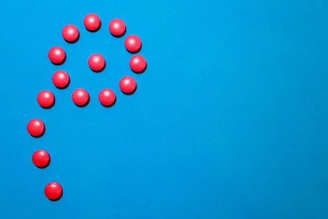 A scattering of red tablets Stock Photos