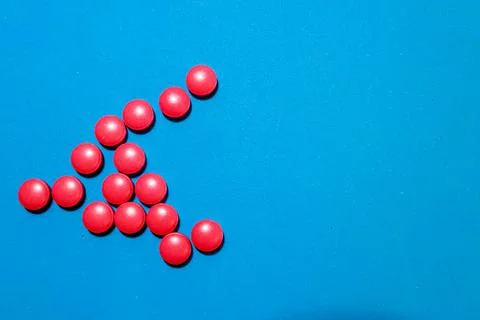 A scattering of red tablets Stock Photos