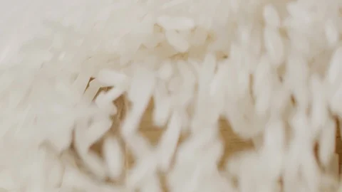 Scattering rice on kitchen table macro shot Stock-Footage 128493936