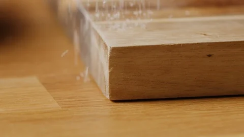 Scattering sugar on kitchen table macro shot Stock-Footage 128493421