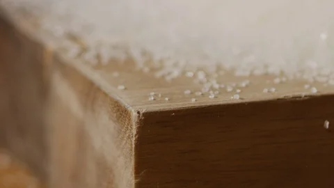 Scattering sugar on kitchen table macro shot Stock Footage 128493572