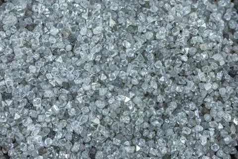 A scattering of various diamonds. Abstract background. Uncut gems, natural shape Stock Photos