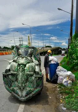 Scavenging for plastics. Stock Photos