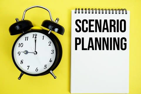 Scenario Planning text with alarm clock flat lay on yellow background Stock Photos