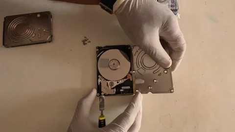 Scene from above showing the technician opening and repairing the SSD hard disc Stock Footage 247817839