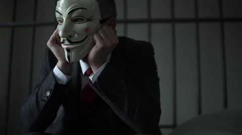 Scene of Anonymous hacker prisoner Stock Footage 60574471