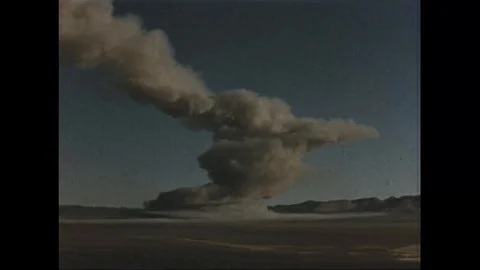 Scene of atomic bomb explosion in desert area of Nevada - 1953 Stock Footage 106047208