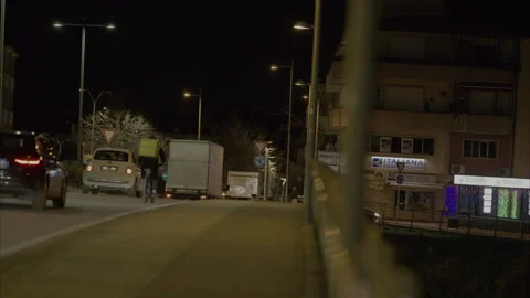 – A scene of a bicycle delivery worker still working late into the niight. Stock Footage 300126590