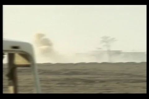 Scene of blowing smoke in the distance at Fallujah, Iraq - 2004 Stock Footage 108262899