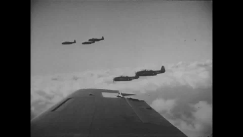 Scene of bomber planes in formation fly over ocean - 1945 Stock Footage 101416433