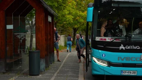 Scene At The Bus Stop - Passengers Getting On and Off On The Bus In Bled Town Stock Footage 324781832