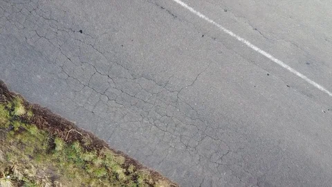 Scene of camera falling into asphalt. Slow movement Видео 121928947