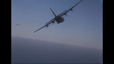 Scene of Camouflaged Lockheed AC-130 in flight during flight test - 1967-1968 Stock Footage 103679072