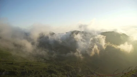 Scene of clouds forming on side of mountain ridge with multiple peaks in shot Stock-Footage 114884197