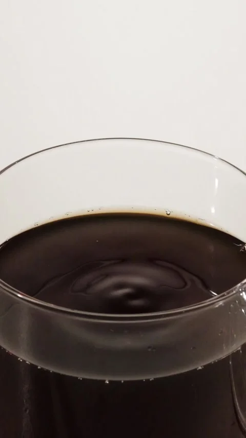 A scene with coffee drops and ripples spreading Stock Footage 321582865