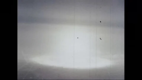 Scene of constant atomic bomb explosion in desert of Nevada - 1953 Stock Footage 106047264