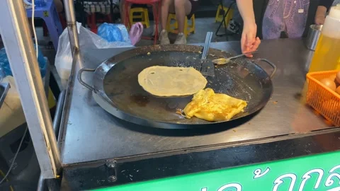 The scene of cooking fried egg banana cake in Ho Thi Ky Street food Stock Footage 219405913