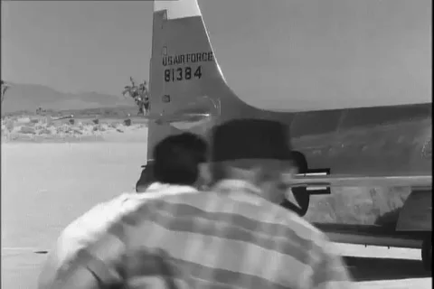 Scene of crew members help Major Chuck Yeager to get out from Bell X-1 - 1954 Stock Footage 104659658