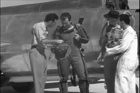 Scene of crew members interact with Major Chuck Yeager - 1954 Stock Footage 104659709