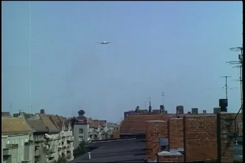 Scene of DC-6 and C-54 come in over apartments and landing singly - 1961 Stock Footage 101166807