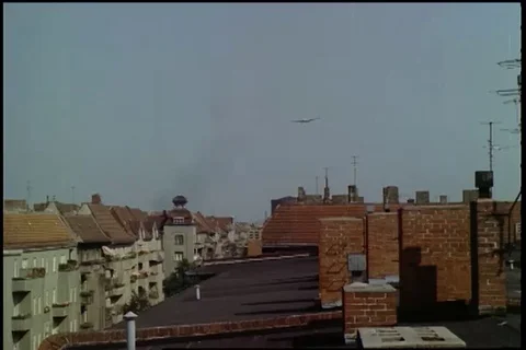 Scene of DC-6 and C-54 come in over apartments and landing singly - 1961 Stock Footage 101166816