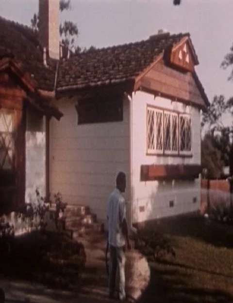 Scene of difference between old and new asbestos side walls application - 1952 Stock Footage 105524998