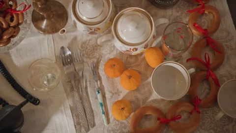 Scene of festive clutter. Laidout table with assorted items. Decorative setting Stock Footage 346563668